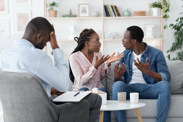 Marriage crisis. Young black spouses arguing at family therapy session